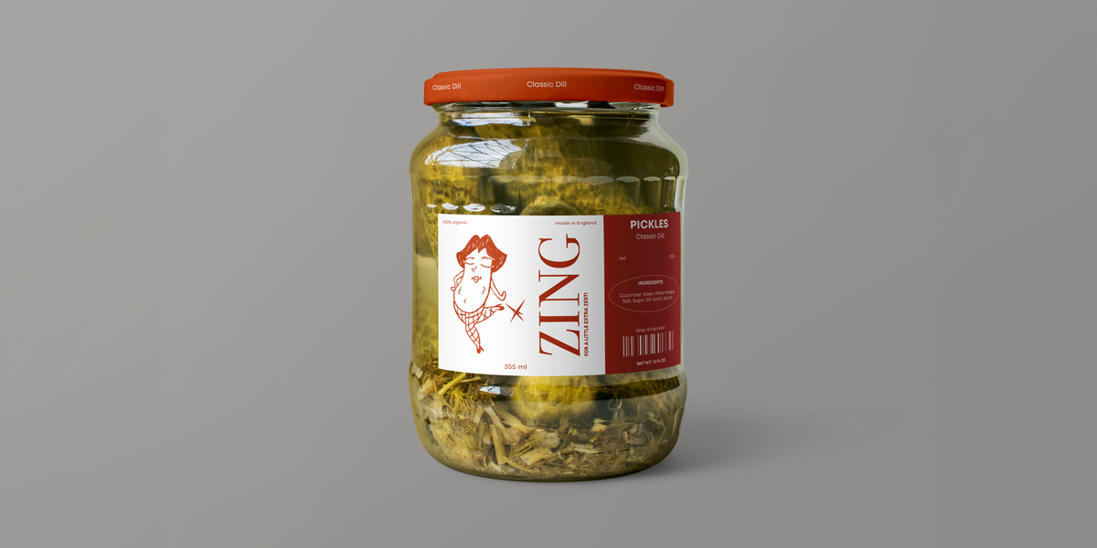 A jar of pickles with a playful pickle wearing a wig on the label. 